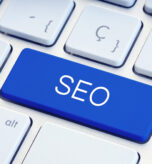 Search engine optimization or SEO Word on blue computer Keyboard Key